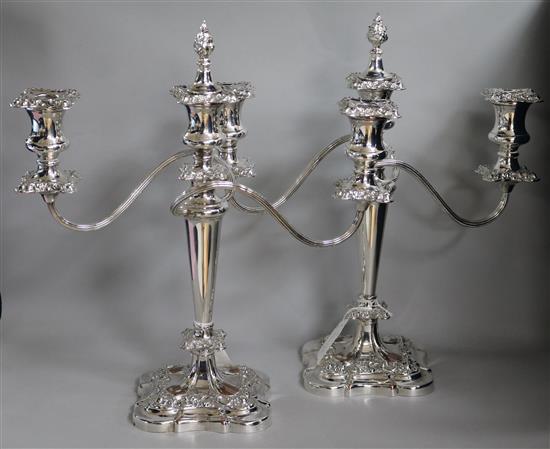 A pair of silver-plated two-branch three-light candelabra